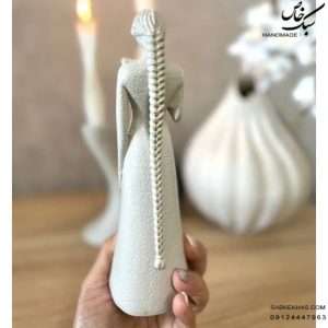 مجسمه دختر گیسو